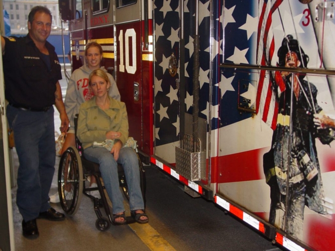 Gabe and her sister, Cait, pose with firefighter from Ground Zero NYC after 9/11 Gabe and her sister, Cait, pose with firefighter from Ground Zero NYC after 9/11